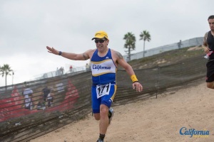 Running down a sand hill, Herbalife LA Triathlon